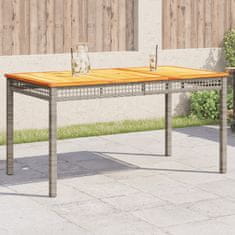 Vidaxl Záhradný stôl sivý 140x80x75 cm polyratan akáciové drevo