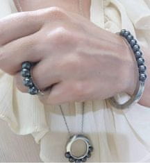 Calvin Klein Pevný oceľový náramok s čiernymi perličkami Circling KJAKMD04010 (Rozmer 5,4 x 4,3 cm - XS)