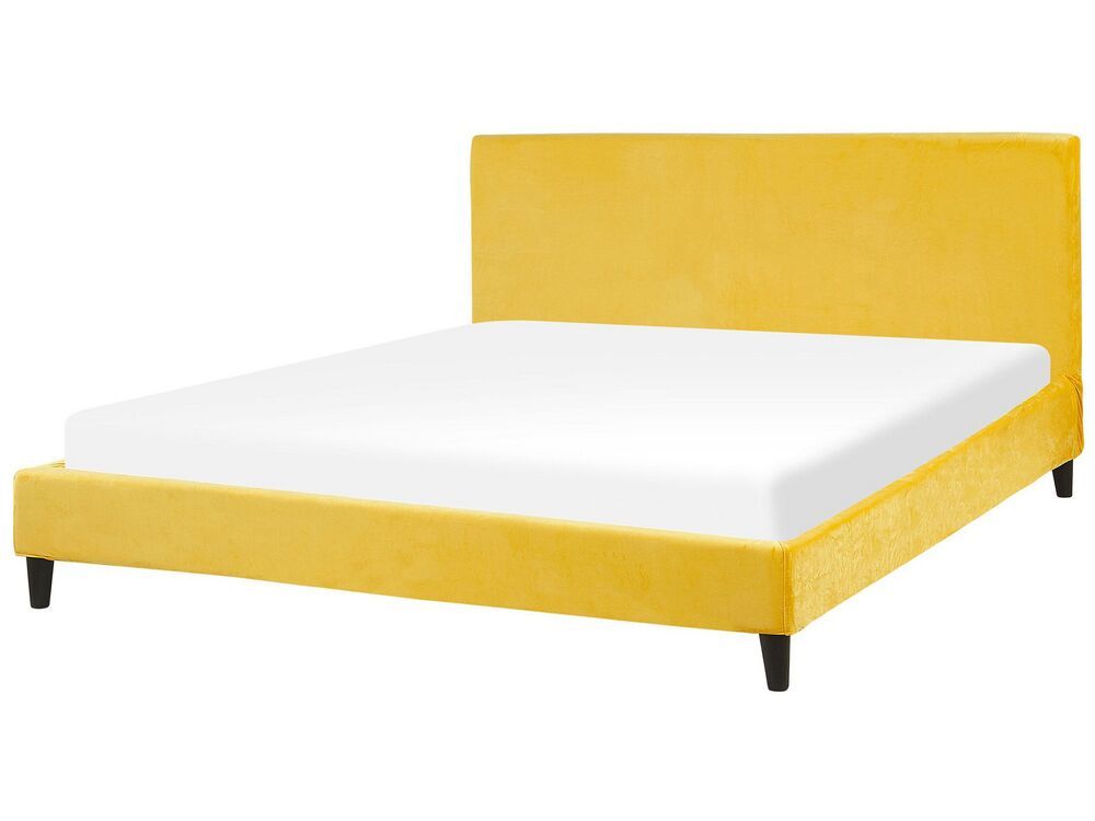 Beliani Čalúnená zamatová posteľ žltá 180 x 200 cm FITOU