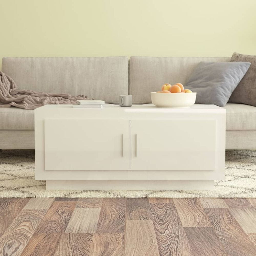 Petromila vidaXL Konferenčný stolík lesklý biely 102x50x45 cm spracované drevo