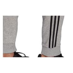 Adidas Nohavice výcvik sivá 188 - 193 cm/XXL Essentials Fleece Tapered Cuff 3STRIPES